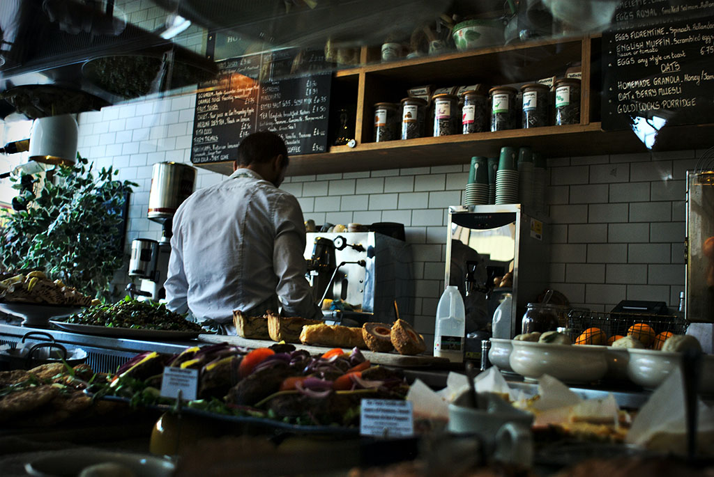 Cafe bar filled with smelly food where some one would not be able to focus on reading quickly.